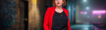 Clare Mackintosh Author in a red jacket